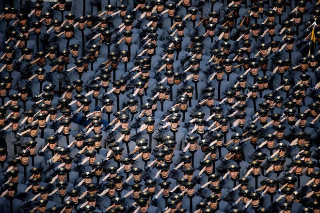 Army Cadets salute before an NCAA college football game between Army and Navy Saturday, Dec. 12, 2015, in Philadelphia.