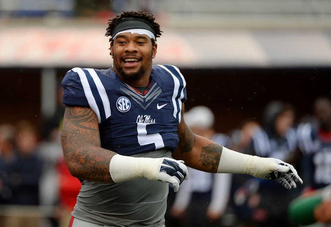 FILE - In this Nov. 7, 2015, file photo, Mississippi defensive tackle Robert Nkemdiche stretches before an NCAA college football game against Arkansas in Oxford, Miss. Police say Nkemdiche was hospitalized after falling from a wall at an Atlanta hotel. Department spokeswoman Kim Jones says it appears that 21-year-old Nkemdiche broke a hotel room window, walked about 15 feet, climbed over a wall and fell roughly 15 feet late Saturday night, Dec. 12, 2015. (AP Photo/Thomas Graning, File)