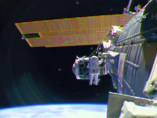 FILE - In this Feb. 21, 2015, file image from television provided by NASA-TV, astronaut Barry "Butch" Wilmore begins a spacewalk to wire the International Space Station in preparation for the arrival in July of the international docking port for the Boeing and Space-X commercial crew vehicles. The station has taken a power hit, and spacewalking repairs may be needed. First, though, a replacement part must be delivered via rocket. (NASA-TV via AP, File)