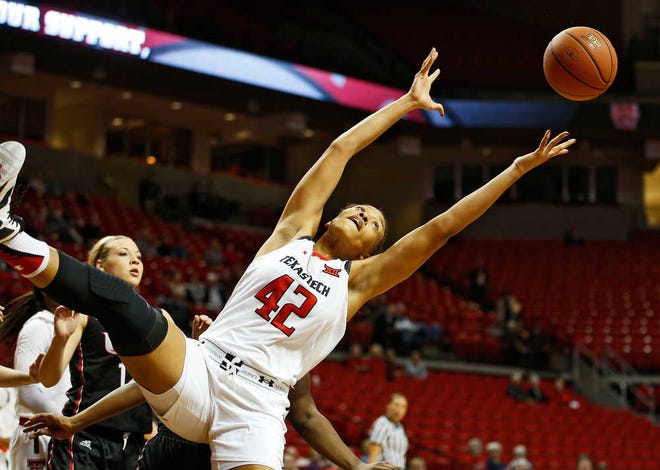 Texas Tech center Ionna McKenzie reaches out to catch a loose rebound during the Lady Raiders' game against Incarnate Word on Monday, Dec. 14, at United Supermarkets Arena in Lubbock.