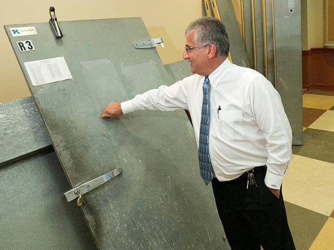 In this Nov. 10 file photo, then-Acting Marion County Administrator Mounir Bouyounes checks out some old freezer doors to be recycled at the old Galaxy Bowling Alley on East Silver Springs Blvd. He has been offered the top county job on a permanent basis.