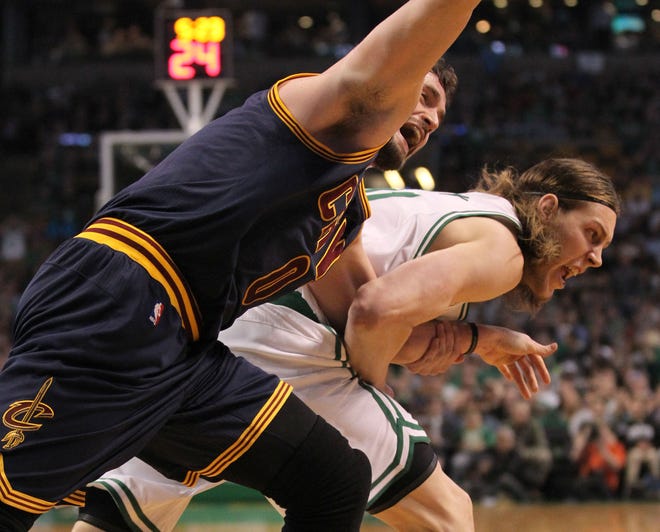 Kelly Olynyk pulls Kevin Love’s shoulder out of its socket while fighting for a rebound during last year's playoffs. The Associated Press