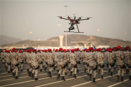 FILE - In this Thursday, Sept. 17, 2015 file photo, a drone is used to record a military parade by Saudi security forces in preparation for the annual Hajj pilgrimage in Mecca, Saudi Arabia. Saudi Arabia said Tuesday, Dec. 15, 2015 that 34 nations have agreed to form a new "Islamic military alliance" to fight terrorism with a joint operations center based in the kingdom's capital, Riyadh. (AP Photo/Mosa'ab Elshamy, File)