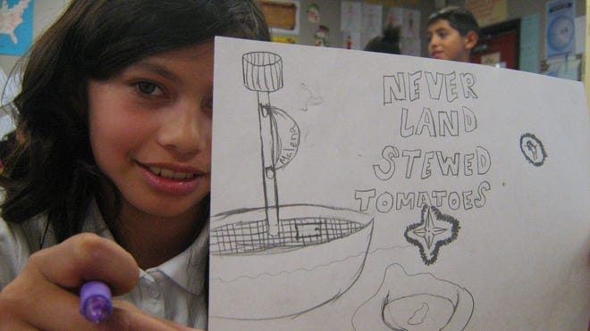 Fifth-grader Malena Perez shows off her as-yet-uncolored label, "Neverland Stewed Tomatoes." MICHAEL FITZGERALD/THE RECORD
