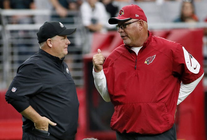 Arizona's Bruce Arians (right) has the Cardinals at 11-2 and a favorite to win the Super Bowl while Philadelphia's Chip Kelly sits at 6-7 this year and battling to make the playoffs.