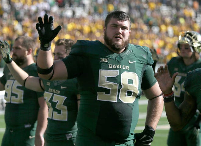 Baylor offensive tackle Spencer Drango (58) stands on the field on Saturday, Dec. 5, in Waco.