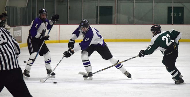 Marshwood/Traip/Sanford defenseman John Lyman (10) carries the puck up ice during the second period of Wednesday’s Maine Class A South boys hockey game against Leavitt at Dover Arena. Mike Zhe/Seacoastonline