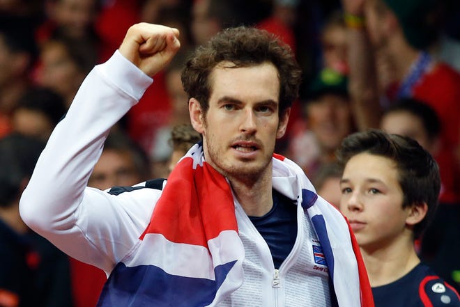 Britain's Andy Murray celebrates winning the Davis Cup after defeating Belgium’s David Goffin in three sets, 6-3, 7-5, 6-3, during their singles Davis Cup final tennis match at the Flanders Expo in Ghent, Belgium, Sunday, Nov. 29, 2015. (AP Photo/Alastair Grant)