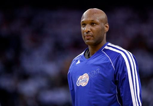 This Jan. 2, 2013, file photo shows Los Angeles Clippers' Lamar Odom during an NBA basketball game against the Golden State Warriors in Oakland, Calif. A four-day binge that culminated in Odom being found unconscious in the Nevada "Love Ranch" placed him atop Google's list of hottest searches during 2015. The annual breakdown released Wednesday, Dec. 16, ranks the inquiries that triggered the biggest spikes in traffic on Google's dominant search engine, excluding queries about sexually explicit subjects. (AP Photo/Marcio Jose Sanchez, File)