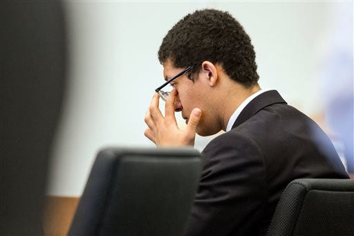 Philip Chism listens to testimony during his trial at Essex Superior Court in Salem, Mass., Monday, Dec. 7, 2015. A psychiatrist testifying at the trial of the Massachusetts teenager charged with killing his math teacher said the teen suffered from psychosis. Chism is charged with rape and murder in the October 2013 slaying of 24-year-old Danvers High School teacher Colleen Ritzer. (Aram Boghosian/The Boston Globe via AP, Pool)