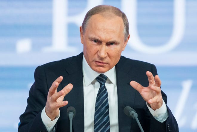Russian President Vladimir Putin gestures during his annual news conference in Moscow, Russia, Thursday, Dec. 17, 2015. President Vladimir Putin says Turkey acted contrary to its own interests by downing a Russian warplane. Speaking at a televised news conference Thursday, Putin said that he sees no possibility of overcoming the diplomatic strain under the current Turkish leadership. (AP Photo/Alexander Zemlianichenko)