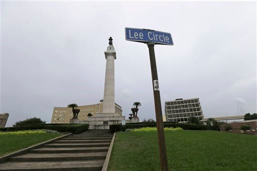 FILE-In this In this Sept. 2, 2015 file photo, the Robert E. Lee Monument is seen in Lee Circle in New Orleans. New Orleans is poised to make a sweeping break with its Confederate past as it contemplates removing prominent Confederate monuments now standing on some of its busiest streets. On Thursday, Dec. 17, 2015, the City Council is set to vote on an ordinance to remove four monuments. A majority of council members and the mayor support the move, which would be one of the strongest gestures yet by American city to sever ties with Confederate history. (AP Photo/Gerald Herbert, File)