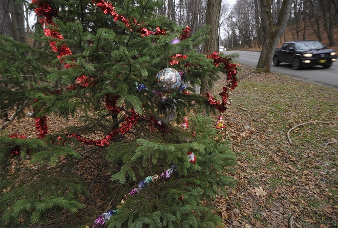 A community "Charlie Brown" Christmas tree is shown on West 41st Street, looking east, in Erie on Dec. 15. GREG WOHLFORD/