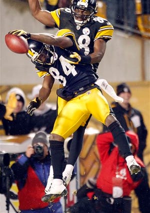 FILE-- In this file photo from Jan. 15, 2011, Pittsburgh Steelers wide receiver Antonio Brown (84) celebrates with Emmanuel Sanders after Brown's long pass reception during an NFL divisional football playoff game against the Baltimore Ravens in Pittsburgh. Sanders and Brown began their careers as members of the "Young Money Family." The former Pittsburgh Steeler teammates will be on opposite sides of the field when Denver visits on Sunday. (AP Photo/Keith Srakocic, File)