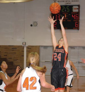Harmony Groves tips a pass in the third quarter Thursday night.