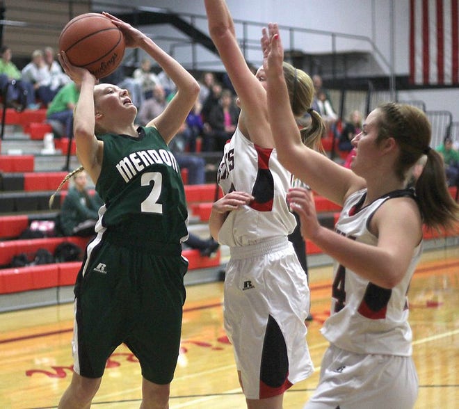 Mary Leighton gets a shot up against White Pigeon defenders on Thursday night.