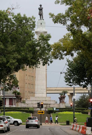 FILE -In this Sept. 2, 2015 photo, the Robert E. Lee Monument is seen in Lee Circle in New Orleans. On Thursday, Dec. 17, 2015, the City Council is set to vote on an ordinance to remove four monuments. A majority of council members and the mayor support the move, which would be one of the strongest gestures yet by American city to sever ties with Confederate history. (AP Photo/Gerald Herbert, File)