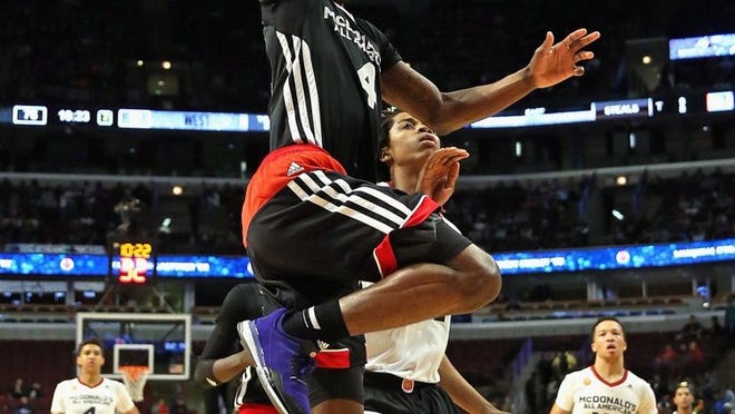 Dwayne Bacon #4 of the East team goes up for a shot past Deyonta Davis #21 of the west team during the 2015 McDonalds’s All American Game at the United Center on April 1, 2015 in Chicago, Illinois. The East defeated the West 111-91. (Photo by Jonathan Daniel/Getty Images)