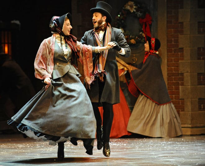 Richly costumed actors dance their way through the opening scene Friday of "A Christmas Carol" at The Hanover Theatre for the Performing Arts in Worcester. A review is scheduled to be published online Saturday and in print Sunday. Additional performances are scheduled through Dec. 27; visit thehanovertheatre.org. T&G Staff/Christine Hochkeppel