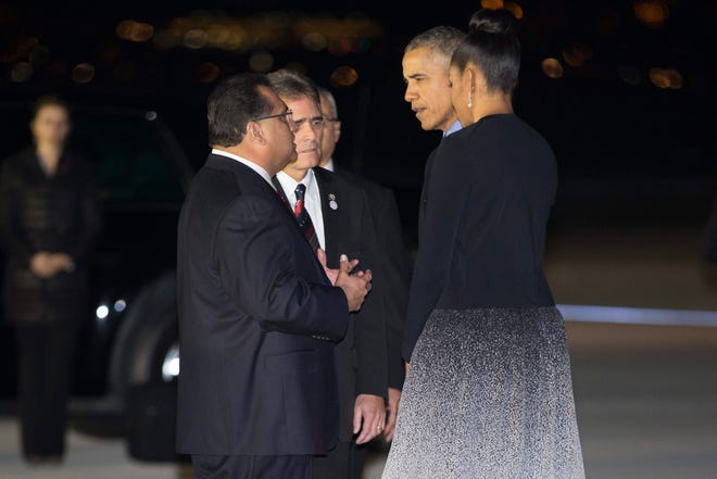 President Barack Obama, second from right, and first lady Michelle Obama, right, talk with San Bernardino Mayor Carey Davis, second from left, and chairman of the San Bernardino County Board of Supervisors James Ramos after arriving on Friday. 

Evan Vucci, The Associated Press