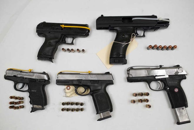 Guns seized during four incidents suspected to be related to gang activity, photographed at the Athens-Clarke County Police Department evidence facility on Friday, Dec. 18, 2015. (AJ Reynolds/Staff, @ajreynoldsphoto)