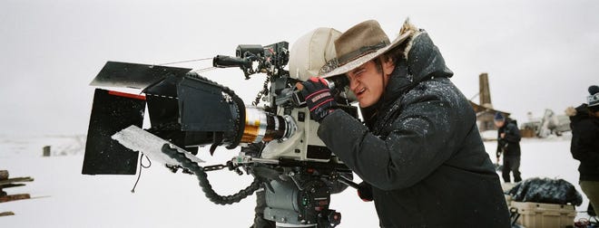 Cutline: Tarantino braves the wintry weather for just the right shot in his new film, "The Hateful Eight."