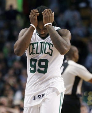 Boston's Jae Crowder reacts after fouling out of Friday's game against Atlanta. The Associated Press