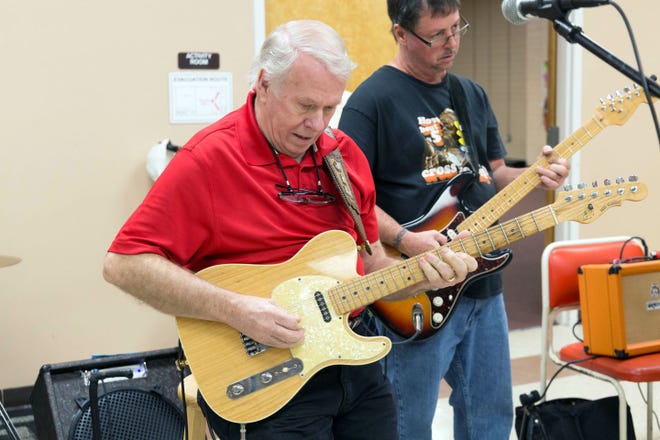 Jim Underwood playing guitar at Music for Seniors at Massey Hill Rec Center on Saturday, December 19th, 2015.