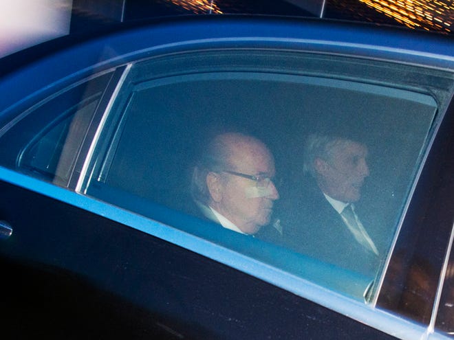 FIFA President Sepp . Blatter , left, and his lawyer Lorenz Erni, leave the FIFA headquarters 'Home of FIFA' in Zurich, Switzerland, Thursday, Dec. 17, 2015.