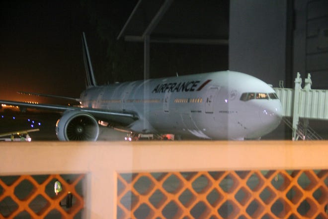 An Air France plane which arrived at Moi International Airport, Mombasa, Kenya Sunday Dec. 20, 2015 to pick passengers after a bomb scare on their earlier flight from Mauritius. (AP Photo)