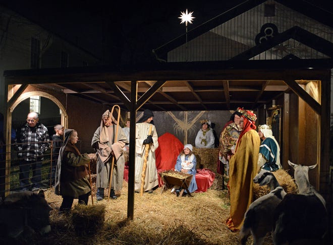 Congregation members participate in a living nativity scene Monday, December 21, 2015, at Fallsington United Methodist Church in Falls.
