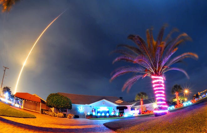 The SpaceX Falcon 9 rocket lifts off over Cocoa Beach, Fla., at Cape Canaveral Air Force Station, Monday, Dec. 21, 2015. The rocket, carrying several communications satellites for Orbcomm, Inc., is the first launch of the rocket since a failed mission to the International Space Station in June. (Craig Rubadoux/Florida Today via AP)