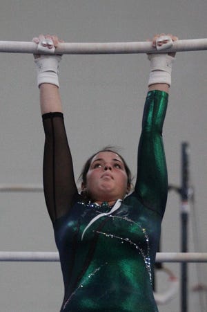 Victoria Foley of Marshfield performs on the uneven bars during a match with Hingham on Friday, Jan. 23, 2015 at the Massachusetts Gymnastic Center in Pembroke. Wicked Local Photo/Mike Springer