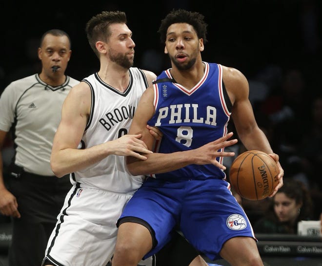 The Sixers; Jahlil Okafor (8) makes his move on the Nets' Andrea Bargnani during a Dec. 10 road loss.