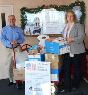 Submitted photo

Daniel Waltz, president/CEO, Southern Mass Credit Union, presents items collected from the 10th annual U.S. Armed Forces holiday drive to Bethany Pinard, family assistance specialist, Massachusetts National Guard.