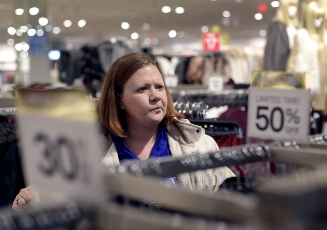 Janae Melvin shops for gifts on Black Friday at Forever 21 in Kansas City, Kan. File Photo/The Associated Press