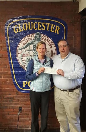 P.A.A.R.I. recently received a $5,000 donation from the Forest Foundation. Pictured, from left, are Laney Makin, program coordinator at the Forest Foundation, and Gloucester Police Chief Leonard Campanello. Courtesy Photo