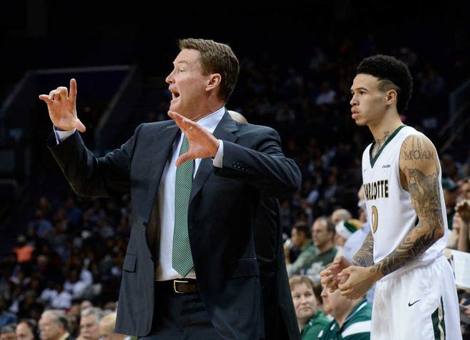 Charlotte coach Mark Price instructs his team from the sideline during an NCAA college basketball game against Georgetown on Tuesday, Dec. 22, 2015, in Charlotte, N.C. Georgetown won 62-59. (Robert Lahser/The Charlotte Observer via AP)