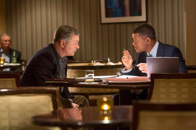Dr. Bennet Omalu (Will Smith) makes a medical point to Dr. Julian Bailes (Alec Baldwin) in “Concussion.” (Columbia Pictures)