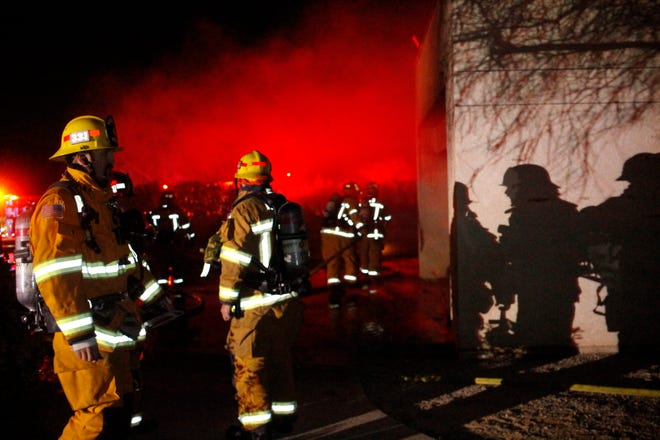 Apple Valley Fire Protection District were on scene of a burning garage at a home in Apple Valley on Christmas Eve. (Brett Marks, for the Daily Press)