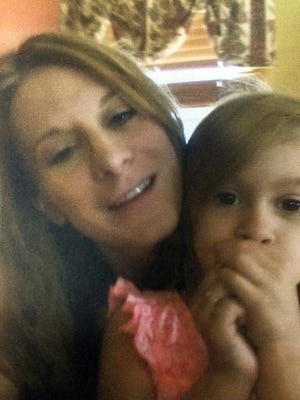 Swan Avenue homicide victim Marie R. Martin of Webster, with her daughter, Julia Biuso-Martin, 5. T&G File Photo