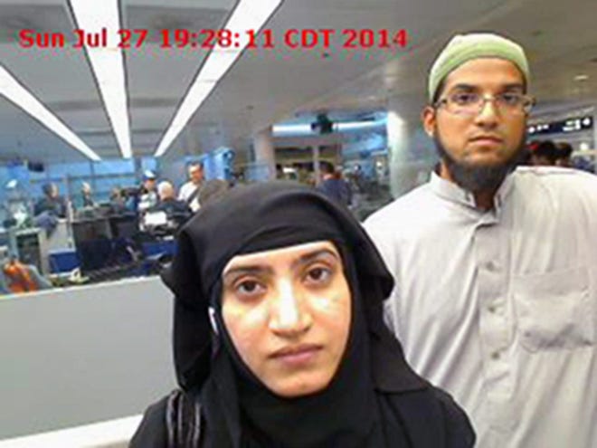 This July 27, 2014 photo provided by U.S. Customs and Border Protection shows Tashfeen Malik, left, and her husband, Syed Farook, as they passed through O'Hare International Airport in Chicago. The attack in San Bernardino, California, that left 14 people dead represented a type of extremist plot law enforcement authorities consider exceedingly difficult to detect: a conspiracy between close family members. U.S. Customs and Border Protection via AP, file