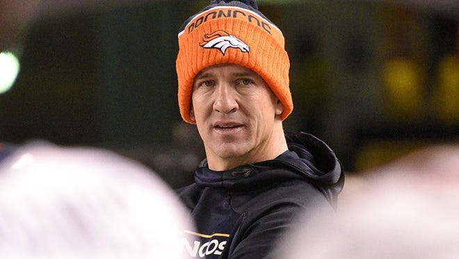 Denver Broncos quarterback Peyton Manning (18) watches from the sideline as his team is losing to the Denver Broncos in the fourth quarter of an NFL football game in Pittsburgh, Sunday, Dec. 20, 2015. (AP Photo/Don Wright)