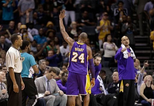 Kobe Bryant waves his appreciation to a sellout crowd of 19,632 at Time Warner Cable as he leaves for the last time in Monday's 108-98 Hornets win over his Lakers.