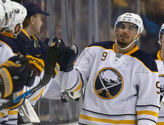 FILE - In this Dec. 26, 2015, file photo, Buffalo Sabres' Evander Kane (9) celebrates his goal during the second period of an NHL hockey game against the Boston Bruins in Boston. On Monday, Dec. 28, 2015, Kane said he's done nothing wrong and is looking forward to clearing his name after being the subject of a sex offense investigation. (AP Photo/Michael Dwyer, File)