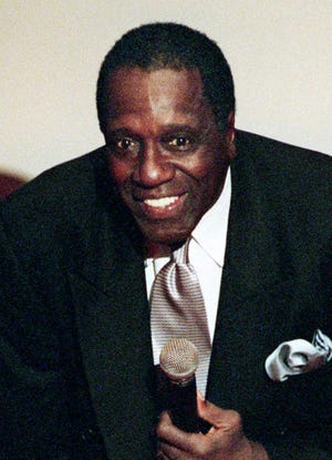 FILE - In this Oct. 16, 1999, file photo, Meadowlark Lemon talks about his friend and former Harlem Globetrotters teammate Wilt Chamberlain at memorial services for Chamberlain in Los Angeles. Lemon, known as the Globetrotters' "clown prince" of basketball, died Sunday, Dec. 27, 2015 in Scottsdale, Ariz. He was 83. (AP Photo/Reed Saxon, Pool, File)