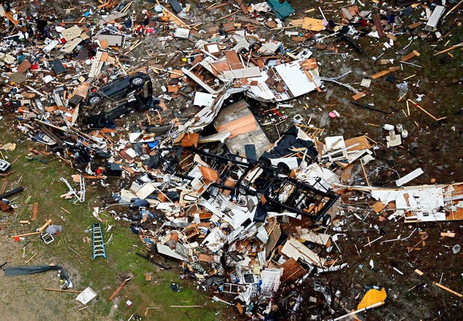 G.J. McCarthy/The Dallas Morning News via APDebris of homes is spread out after Saturday's tornado in Garland, Texas, on Sunday.