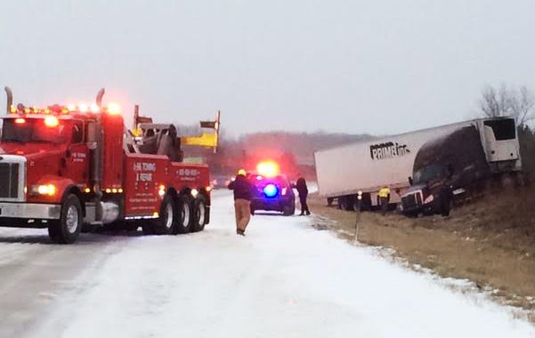 A semi-truck is removed from the side of the road Monday afternoon on I-96 near the Kent County line.