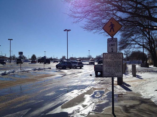 The parking lot at City Hall was mostly cleared of snow and ice just before noon Tuesday afternoon in downtown Lubbock.