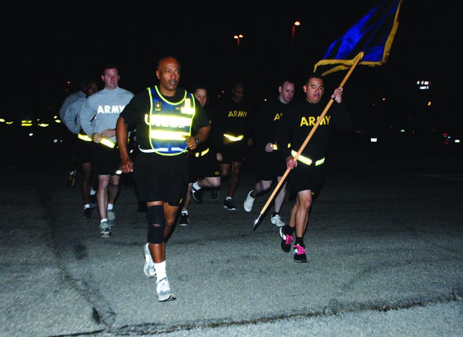 Command Sgt. Maj. Terry E. Parham Sr., U.S. Army Combined Arms Support Command CSM, leads a formation of several hundred noncommissioned officers during a run honoring Parham on Dec. 16. Patrick Buffett/Fort Lee Public Affairs